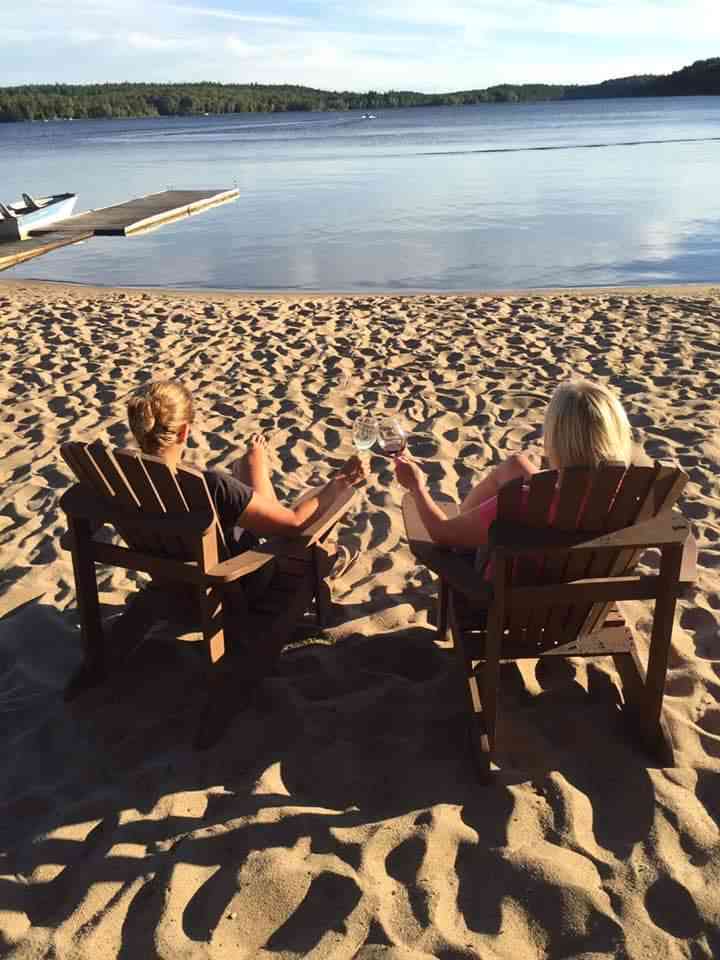 Two women sunbathing on the beach